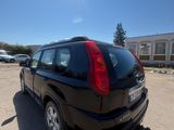a black car that is parked in a parking lot