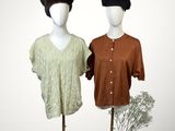 pair of mannequins with hats on display in front of a white background