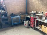 a garage with a lot of tools and tools on the shelves