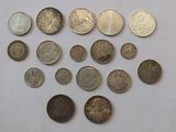 a lot of coins that are on the table