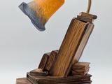 a lamp that is sitting on top of a pile of books