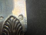 a close up of a knife on a table