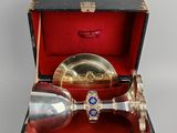 a silver spoon and a silver spoon in a box
