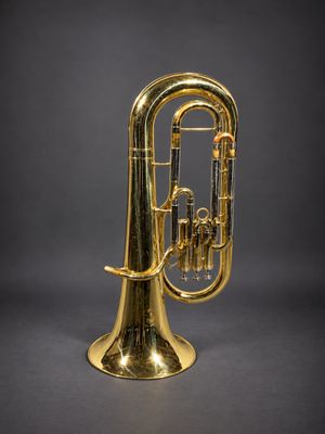 a brass trumpet with a brass bell on a black background