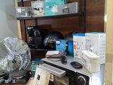 a microwave and a fan on a table in a room