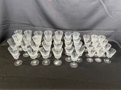 a bunch of wine glasses sitting on top of a table