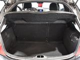 the back of a car with its trunk open and a police officer in the back seat