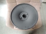 a gray object on a chair that is in a room