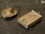 two metal objects that are on a table