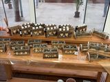 a wooden table with a lot of pots and containers on it