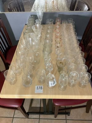 a lot of empty wine glasses on the table