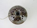 a small metal object that is on a white surface