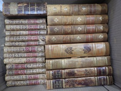 many old books in a box on the floor