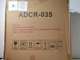 a cardboard box with a sign on it that says adcr - 035