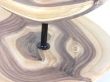 a three tiered cake stand with two plates on top of it