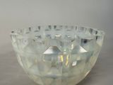 a clear glass bowl with a geometric design on it