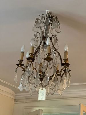 a chandelier hanging from the ceiling in a room