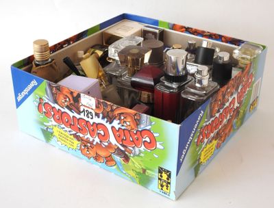 a box of assorted perfumes on a white surface