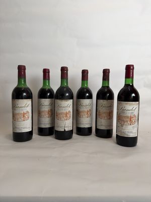 six bottles of wine are lined up in a row on a table