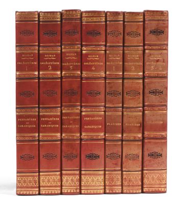a set of five books with red covers and gold trims