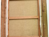 the frame is made out of wood and has a cork board in it