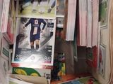 a clear box filled with magazines and other items