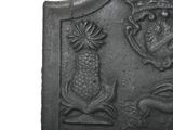 an image of a plaque with animals and flowers on it