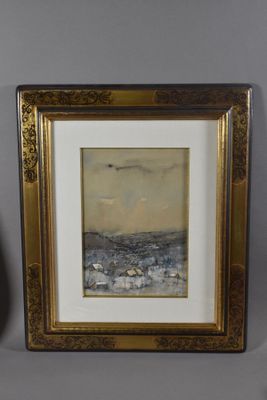 painting of a beach scene in a gold frame next to a vase