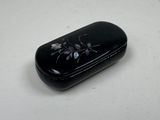 a black case with flowers on it sitting on a table