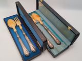 an image of a set of silverware in a blue box