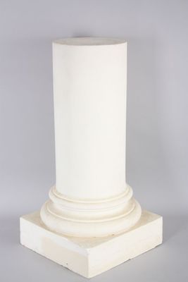 a close up of a white pillar on a grey background