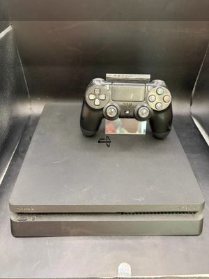 a video game controller sitting on top of a metal box