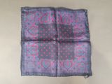 a close up of a purple and blue square with pink dots on it