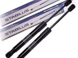 a close up of a pair of black stapluss on a white background