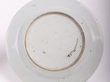 a white plate with a gold rim and a white plate with a gold rim