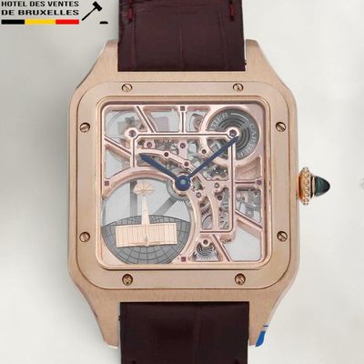 a close up of a wrist watch with a brown strap