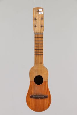 an image of a wooden ukulele hanging from a string
