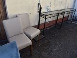 two chairs and a table in the corner of a room