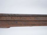 a close up of a metal object with writing on it