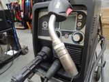 a welding machine with a hose attached to it