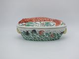 an image of a white bowl with a fish design on it