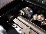 a musical box with bells and bells inside of it