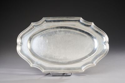 a silver plate that is sitting on a table