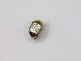 a close up of a gold ring with a white background