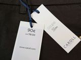 a close up of a pair of pants with a price tag on it
