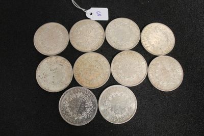 six different types of coins on a black surface with a price tag