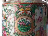 a vase with a handle that has a picture on it
