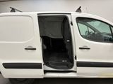 a white van with its doors open in a garage