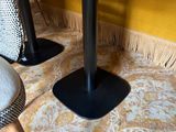 two chairs and a table in the corner of a room