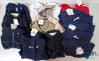 a lot of clothes that are sitting on a table